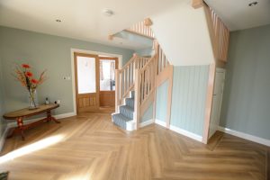 Stairs of a chalet bungalow leading up to the second storey created by Bespoke Norfolk Group in Kings Lynn
